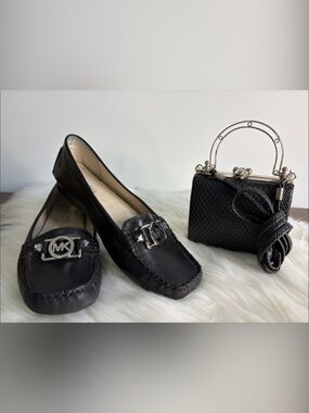 Small Black Clutch with detachable shoulder strap.  Silver accents